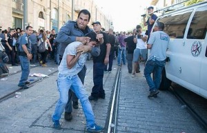 Photo: Police violence at a protest after the murder of three youth in June of 2014. Honenu handled the cases of over 30 detainees. Photo credit: Ohad Tzviganberg