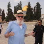 Photo: Yehuda Etzion on the Temple Mount with arms raised; Photo credit: Adam Prop