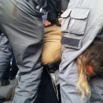Demonstrator violently detained opposite Petah Tikva Magistrate Court; Photo credit: Honenu