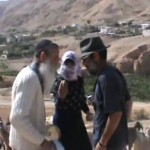 Photo (snapshot from video clip): Rabbi Meshulami assaulted; Video credit: Mevo’ot Yericho